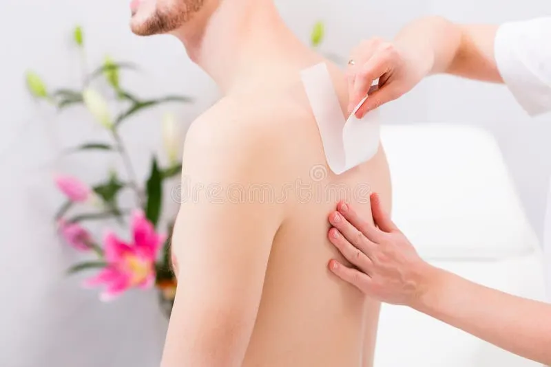 man waxing hair removal beauty parlor receiving 58189695